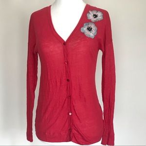 Red cardigan with floral design